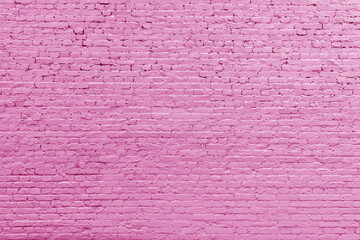 Pink brick wall. Loft interior design. Pink paint of the facade. Architectural background.