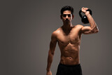 Fototapeta Przeznaczenie - Fit Handsome Latin Man Exercising With Kettlebell