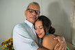 © Hector Pertuz - Latin Young daughter hugs her father