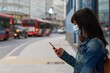 © Wirestock Exclusives - A CORUÃ±A, SPAIN - Jun 01, 2020: Women checking her phone in the bus stop