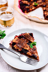 Wall Mural - Slice of Delicious Homemade Berries Honeysuckle Pie on beige linen tablecloth. Selective focus