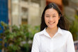 © Ranta Images - Portrait of young beautiful Asian businesswoman outdoors