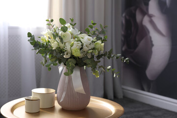 Beautiful bouquet of flowers on table in room. Stylish interior design