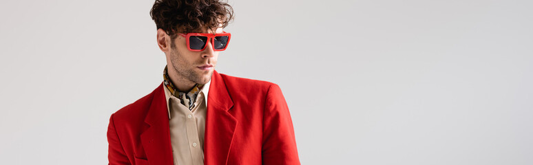Wall Mural - website header of fashionable man in red blazer and sunglasses isolated on grey