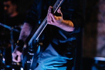 Wall Mural - Shallow focus shot of the guitarist at the concert