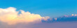 Panorama of blue sky with light and dark clouds at sunset
