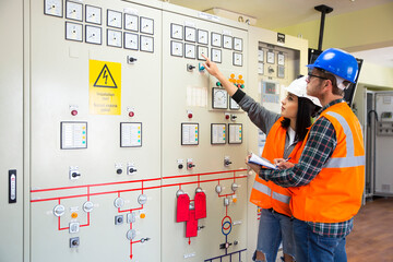 Professional industrial engineers operating in electricity substation