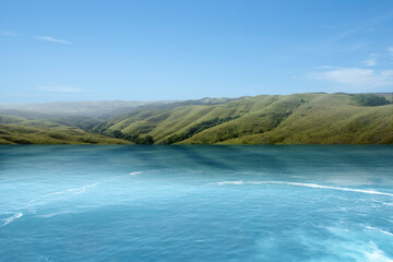 Lake and green hills with summer climate