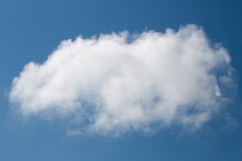 Large White Fluffy Cloud In Blue Sky