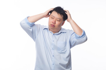 Wall Mural - Young Fat Asian business man feeling sad with unhappy face isolated on white background.