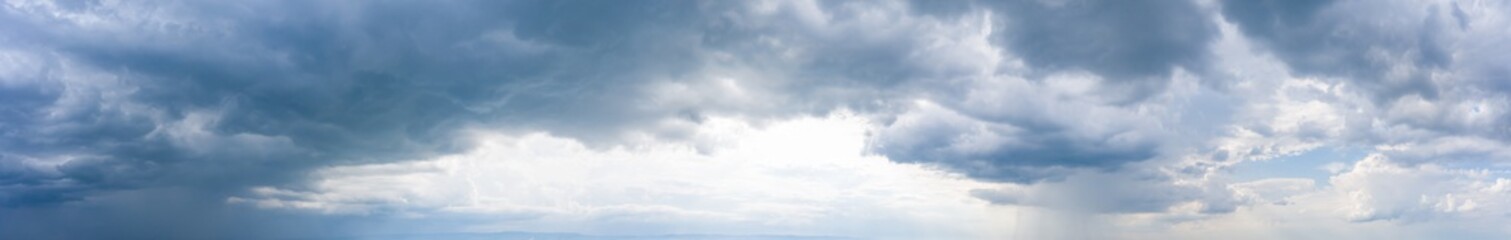 overcast sky with rain, weather conditions and forecast. dramatic ultra-wide panoramic background of