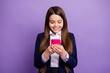 © deagreez - Portrait of her she nice small little focused cheerful cheery long-haired girl using device browsing social network news post isolated bright vivid shine vibrant lilac violet color background