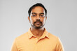 © Syda Productions - people and furniture concept - portrait of young indian man over grey background