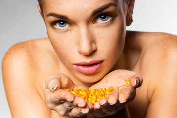 woman holding sea-buckthorn in hands