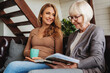 © InsideCreativeHouse - Low angle view of middle aged woman spending time with her senior mother at home