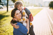 © Sviatlana - A mother hugs her young son on the way to school, and a mother and boy say goodbye before school. Concept of education and training, return to school