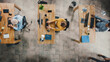 © Gorodenkoff - Top View Shot in the Office: Diverse Group of Business Startup Employees Sitting at their Desks Working on Desktop Computers. Stylish and Modern Office Loft with Professionals Doing their Job