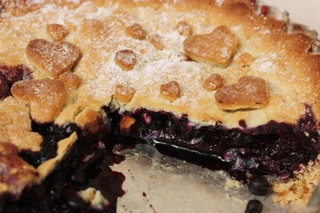 Delicious blueberry pie on the table macro