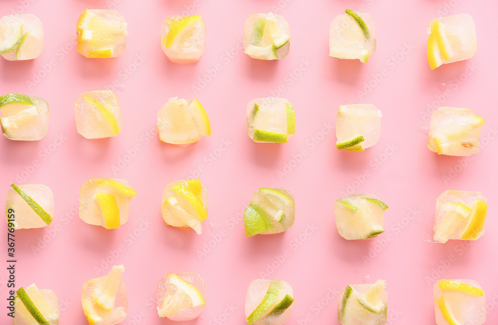 Ice with frozen citrus fruits on color background