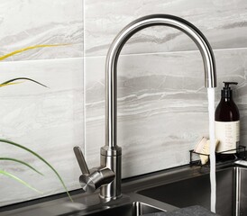 Sticker - New and  modern steel faucet in the kitchen