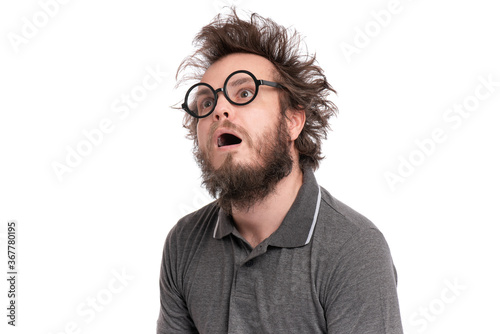 Fotomural Crazy Scared or Shocked Bearded Man with funny Haircut in Eyeglasses looks Worried