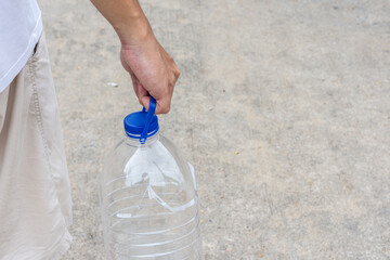 a man hold a water plastic bottle