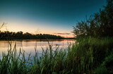 Fototapeta  - Summer sunset on the river, beautiful scenery