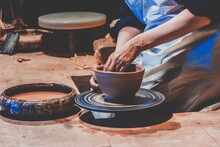 Closeup Shot Of Female Hands Making Ceramic Pot On The Pottery Wheel