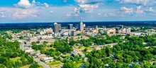 Aerial Shot Of The Skyline Of Greensboro Located In North Carolina, USA, On A Partly Cloudy Day