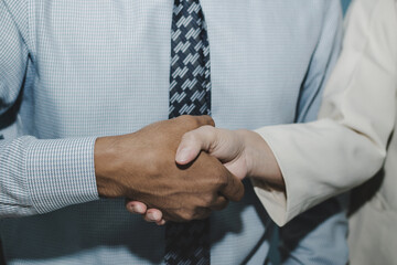 Wall Mural - partnership. two business man investor handshake deal with partner after finishing up business meeti