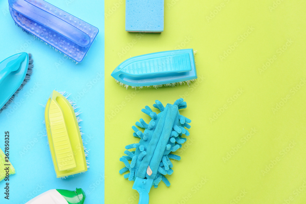 Set of cleaning supplies on color background