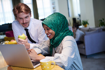 Wall Mural - international multicultural business team working together on laptop