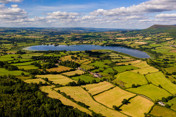 Wall Mural - Aerial view of a lake and farmland