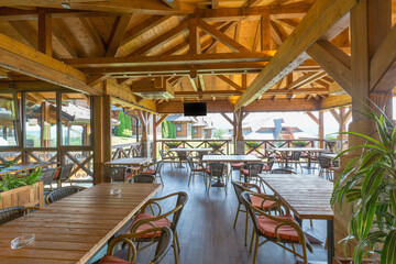 Wall Mural - Interior of a hotel restaurant with wooden furniture