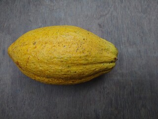 Wall Mural - Cocoa fruit on a wooden background