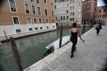 Canvas Print - woman walking in venice