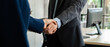 © May Chanikran - Business people shaking hand together in the office.