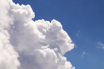 White fluffy and blue sky with clouds (Cumulus clouds).