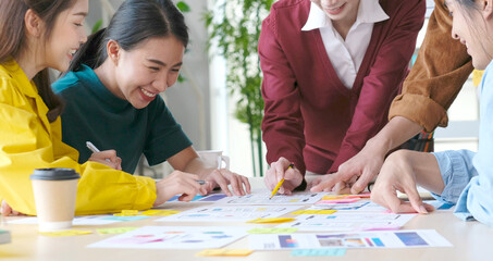 Wall Mural - brainstorm planing creative asian teamwork, group of asia mobile phone app developer team meeting fo