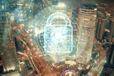 Fototapeta Miasto - Lock icon hologram on city view with skyscrapers background multi exposure. Data security concept.