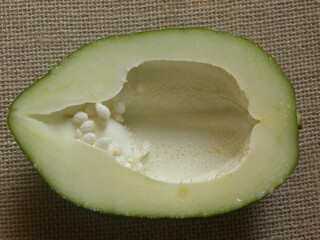 Wall Mural - Cut cross section detail of white color raw Papaya fruit