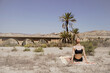 © Manu Reyes - Young active woman practicing yoga in desert on sunny day, health and active life concept