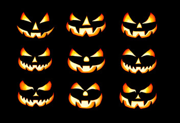 Wall Mural - nine lit evil halloween lantern faces, jack o lantern, with glowing eyes isolated against a black ba