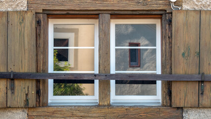 old wooden window with shutters