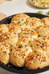 Sticker - Freshly-made delicious cheese bubble pizza bread with ingredients and cheese on a white table