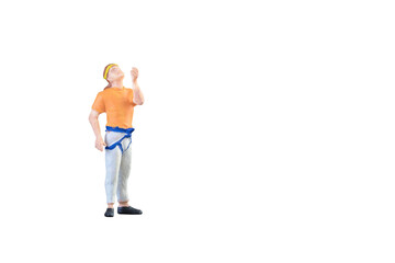 Close up of Miniature people doing climbing sport isolated with clipping path on white background.