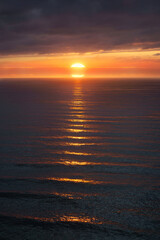 Wall Mural - dark sunset on the sea with beautiful waves and ripples