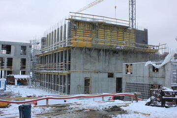 Concrete building under construction in winter