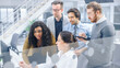 © Gorodenkoff - In Modern Office: Diverse Team of Young Motivated Businessmen and Businesswoman Work on Computer, Having Discussion, Finding Problem Solution Collectively. Ambitious Businesspeople Successful Teamwork