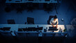 © Gorodenkoff - Alone Working Late at Night in the Office: Businesswoman Using Desktop Computer, Analyzing, Using Documents, Solving Problems, Finishing Project. High Angle Shot